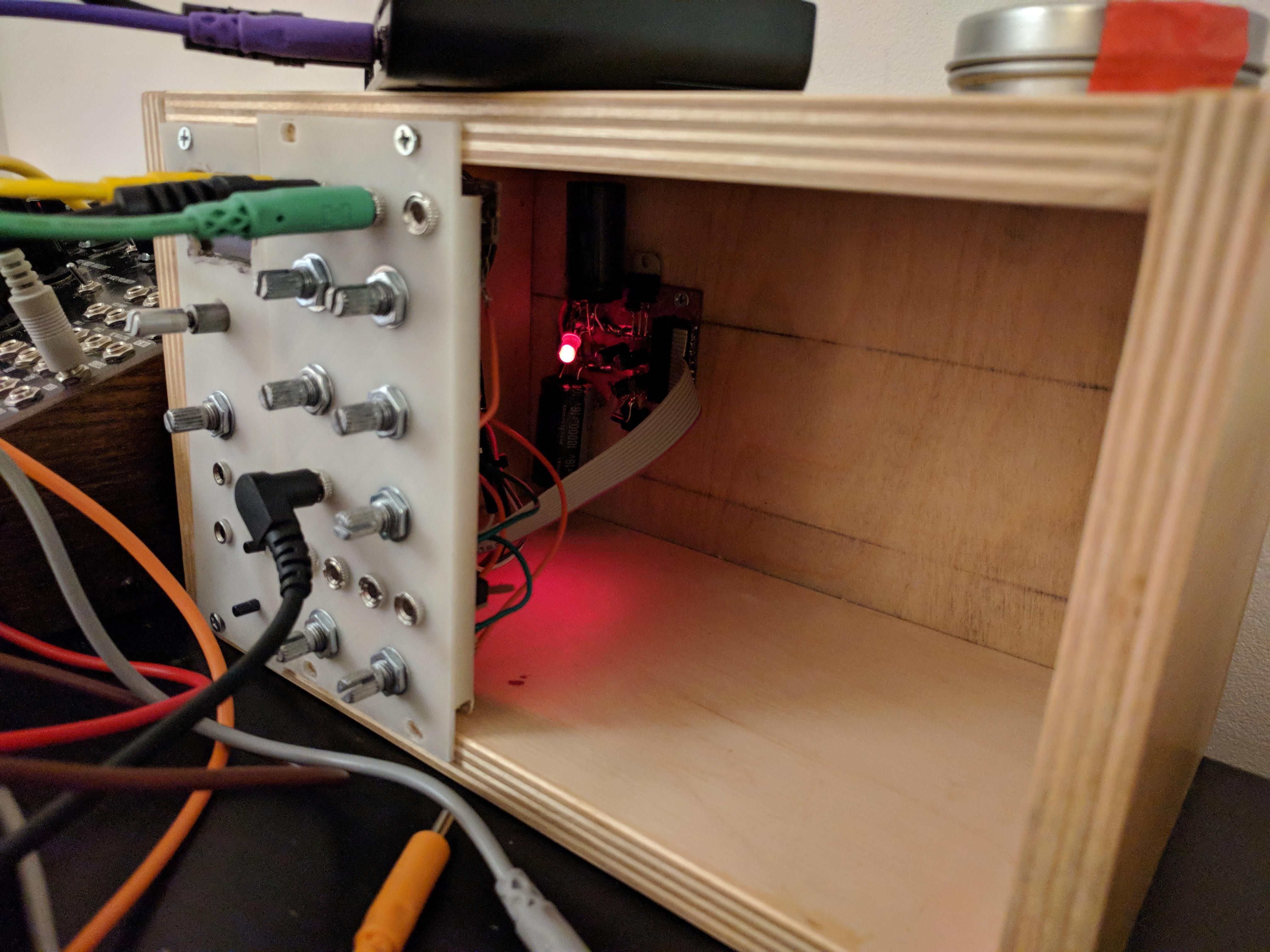Photo of the copper clad board in the previous photo after etching. The parts that were drawn in sharpie are now copper traces, the rest is bare non-conductive board.
