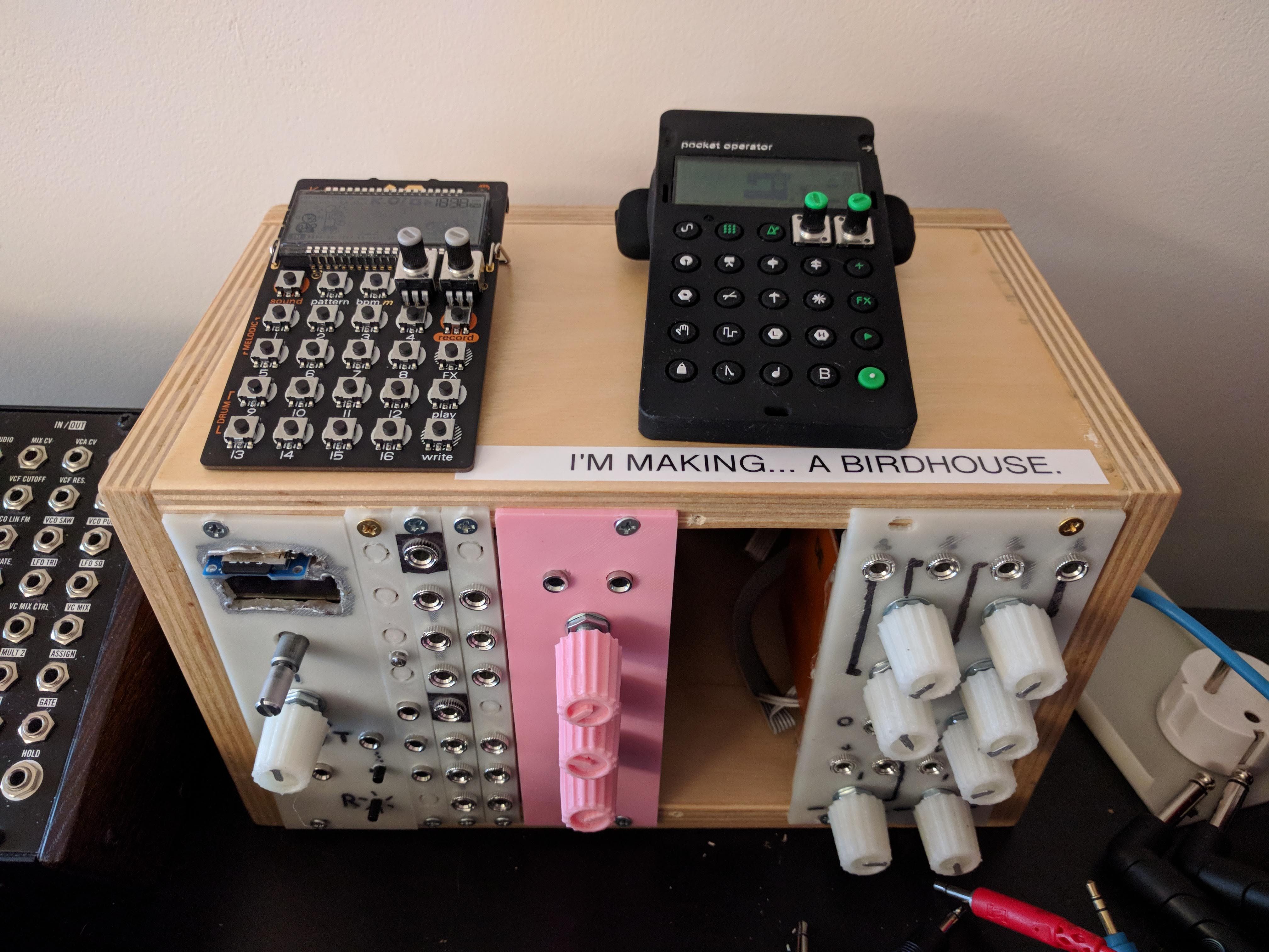 A synthesizer with a sticker on it that says 'Im making a birdhouse'